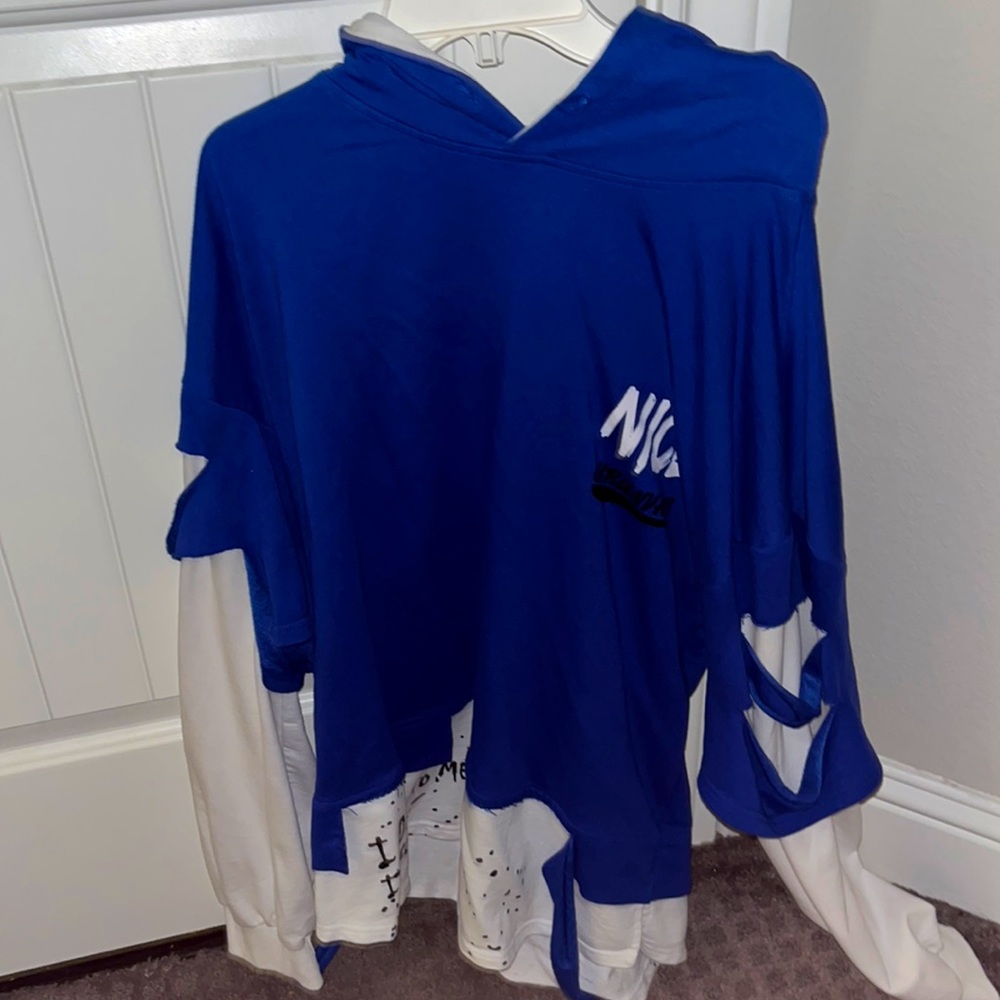 Blue and white street design hoodie. Good condition hoodie that fits long